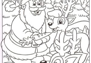 Coloriage Du Pere Noel Gratuit Coloriage Le Père Noël Nourrit Ses Rennes